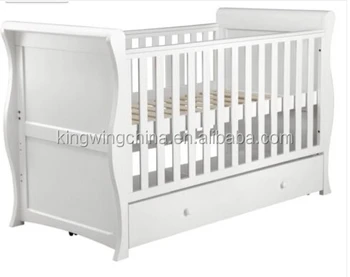 white wooden cot bed with mattress