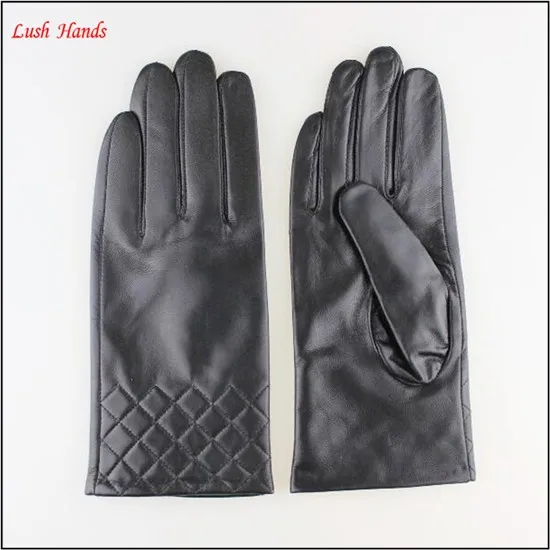 Women's leather gloves with sewings design at bottom