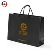 China Custom Logo Large Fancy Matte Black Hot Stamping Gold Foil Printing Gift Paper Bag