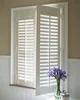 Basswood security bi-fold plantation shutter windows