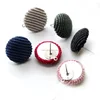 Ear nail with fabric covered round button
