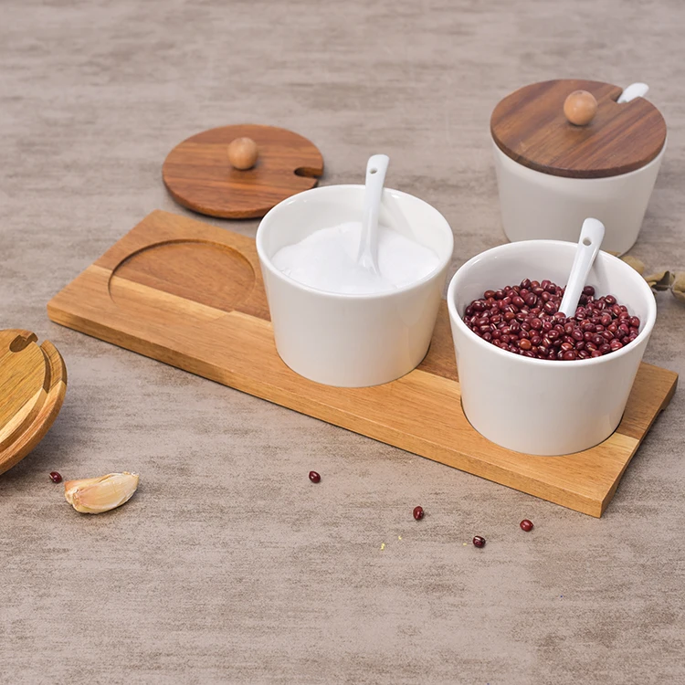 Hot sale kitchen used white ceramic spice pots seasoning pot spice jar with wood stand .jpg