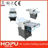 Automatic air suction paper folding machine
