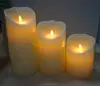 A set of 3 battery operated flameless moving wick led candles with remote control