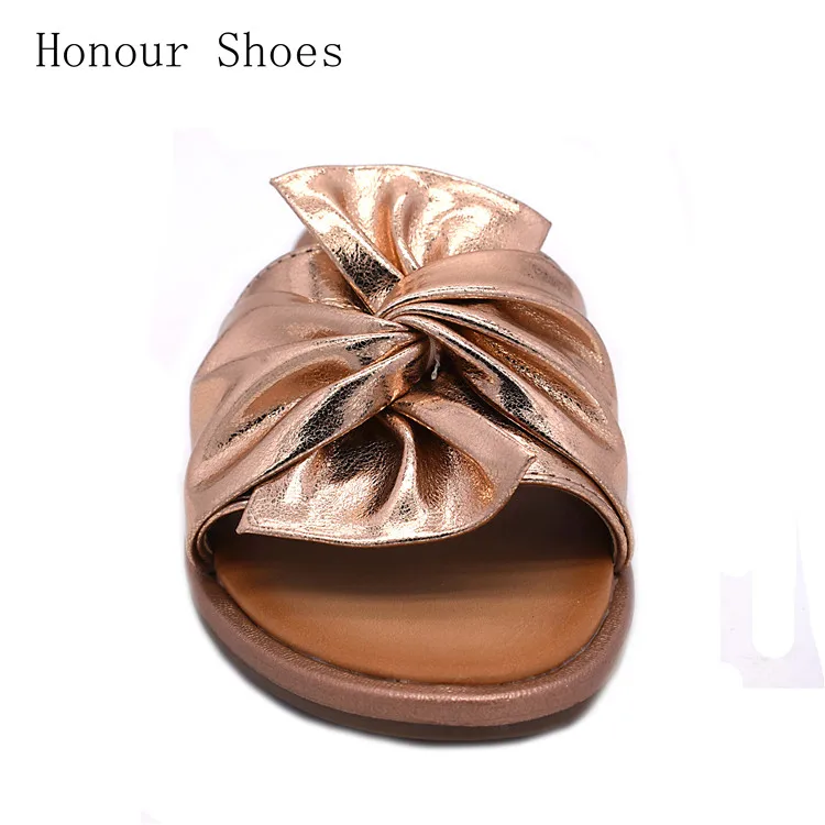 gold flat sandals with bow