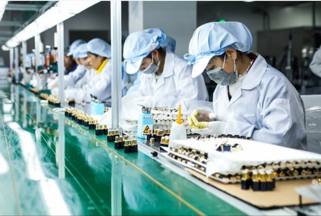 Cosmetics factory. New workers in Manufacturing pictures.