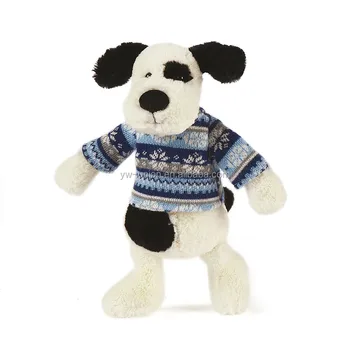 black and white plush dog