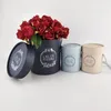 Luxury wrapping round flower box with lid for flowers paper tube packaging with rope handle