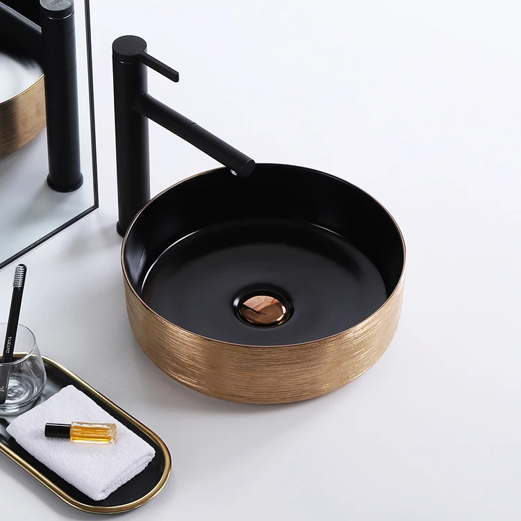 Vanity luxury gold and black color hotel washroom small round art washbasin ceramic table top bathroom sink hand wash basin manufacture