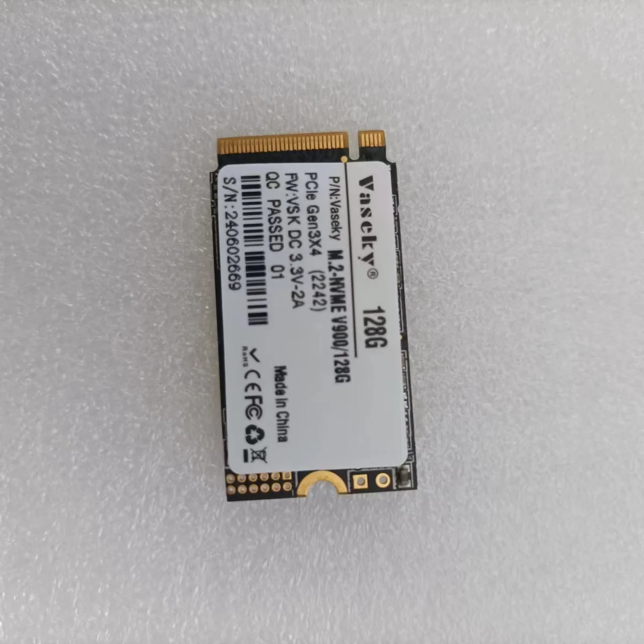 M.2 2242 SSD next to a US quarter for size comparison