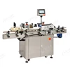 Automatic label pasting machine for round bottles and cans
