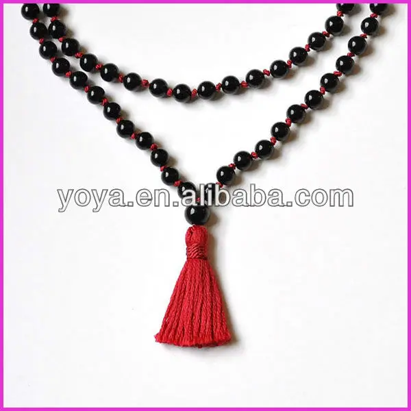 Turquoise mala necklace with red tassel.jpg