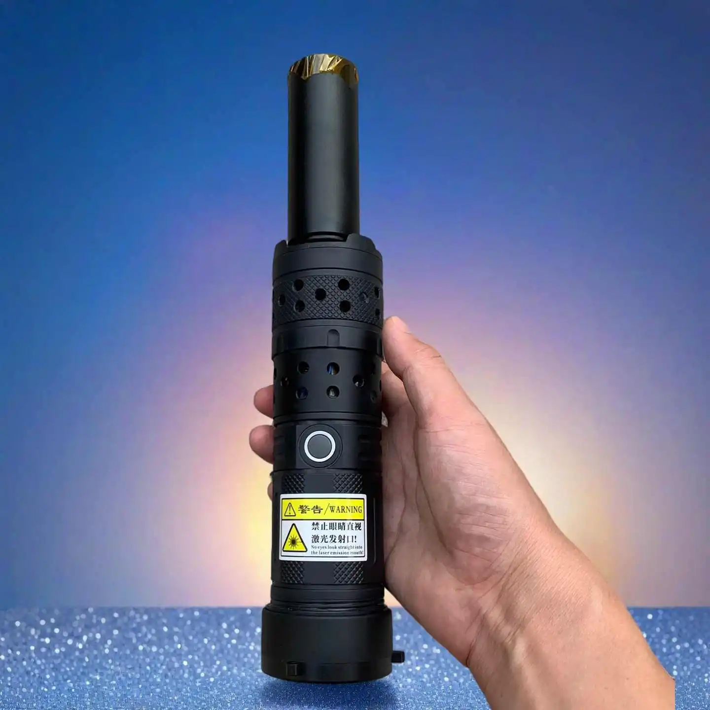 Side view of a handheld blue laser module with heatsink and safety key