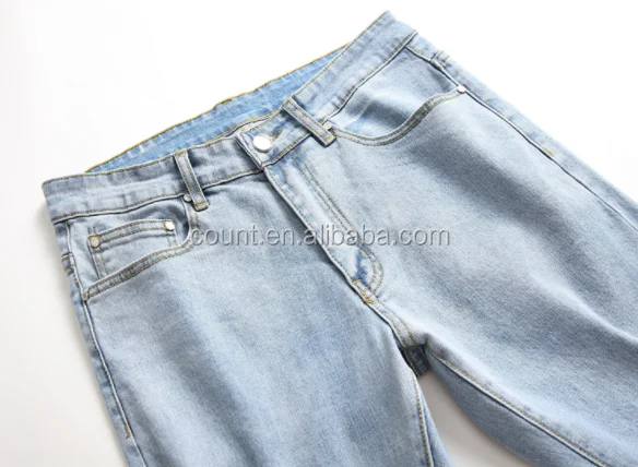 men's light colored ripped jeans