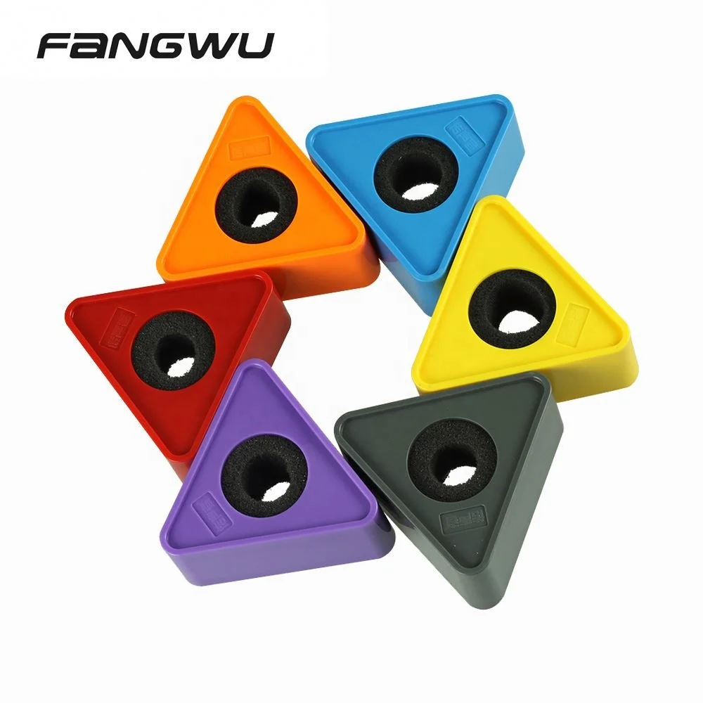 Side-by-side comparison of two custom microphone logo cubes: one with tight rubber wedge grip, another with loose fit showing visible gap