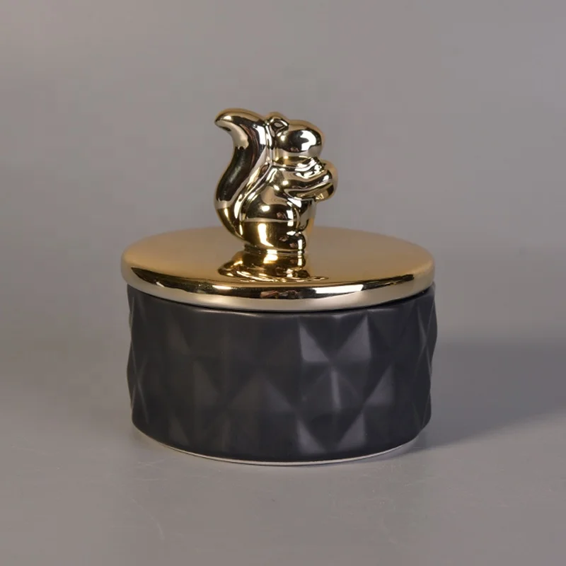 Unique black ceramic candle holder with gold lid for home decor