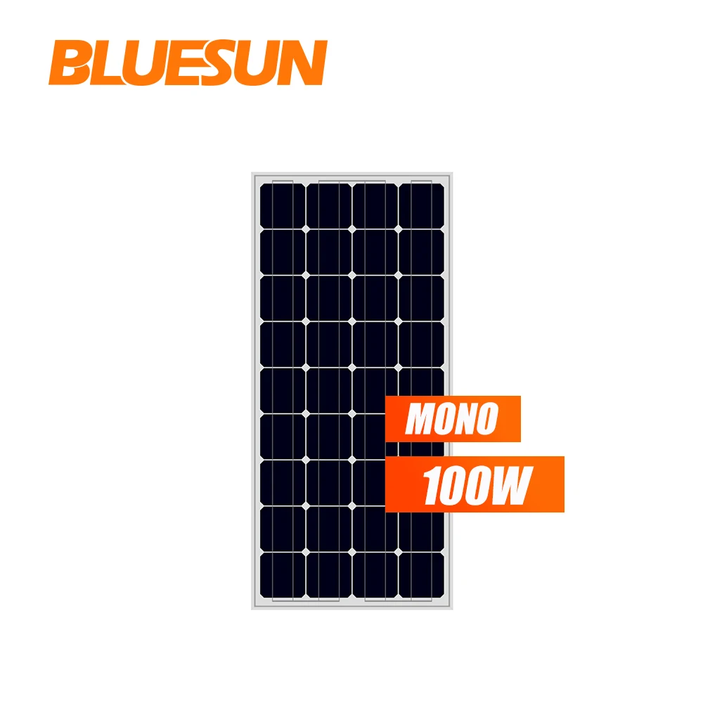 Foldable 100W solar panel laid open on grass, showing segmented PET-laminated surface and built-in kickstand