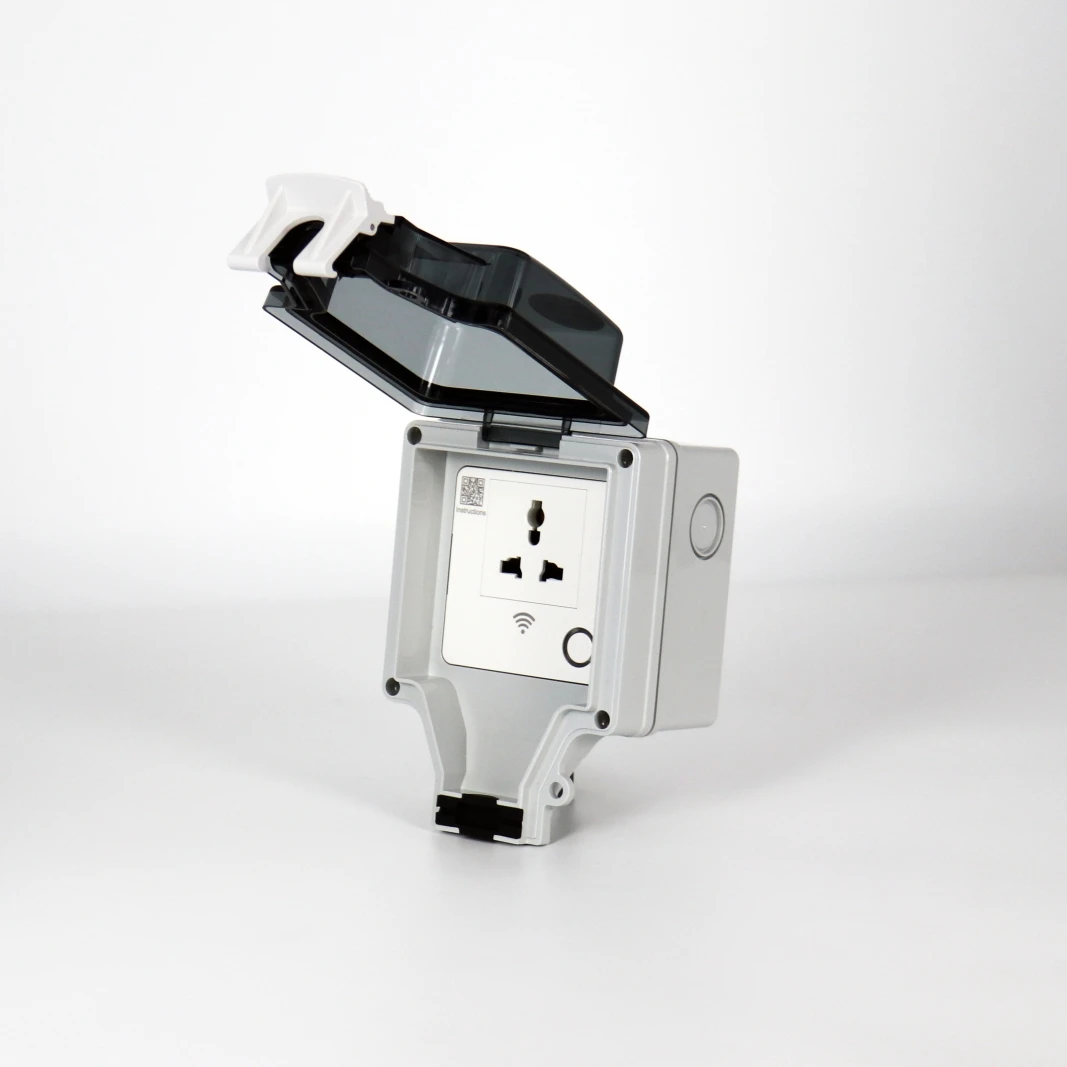 Compact 15 amp smart plug plugged into wall outlet next to lamp and fan