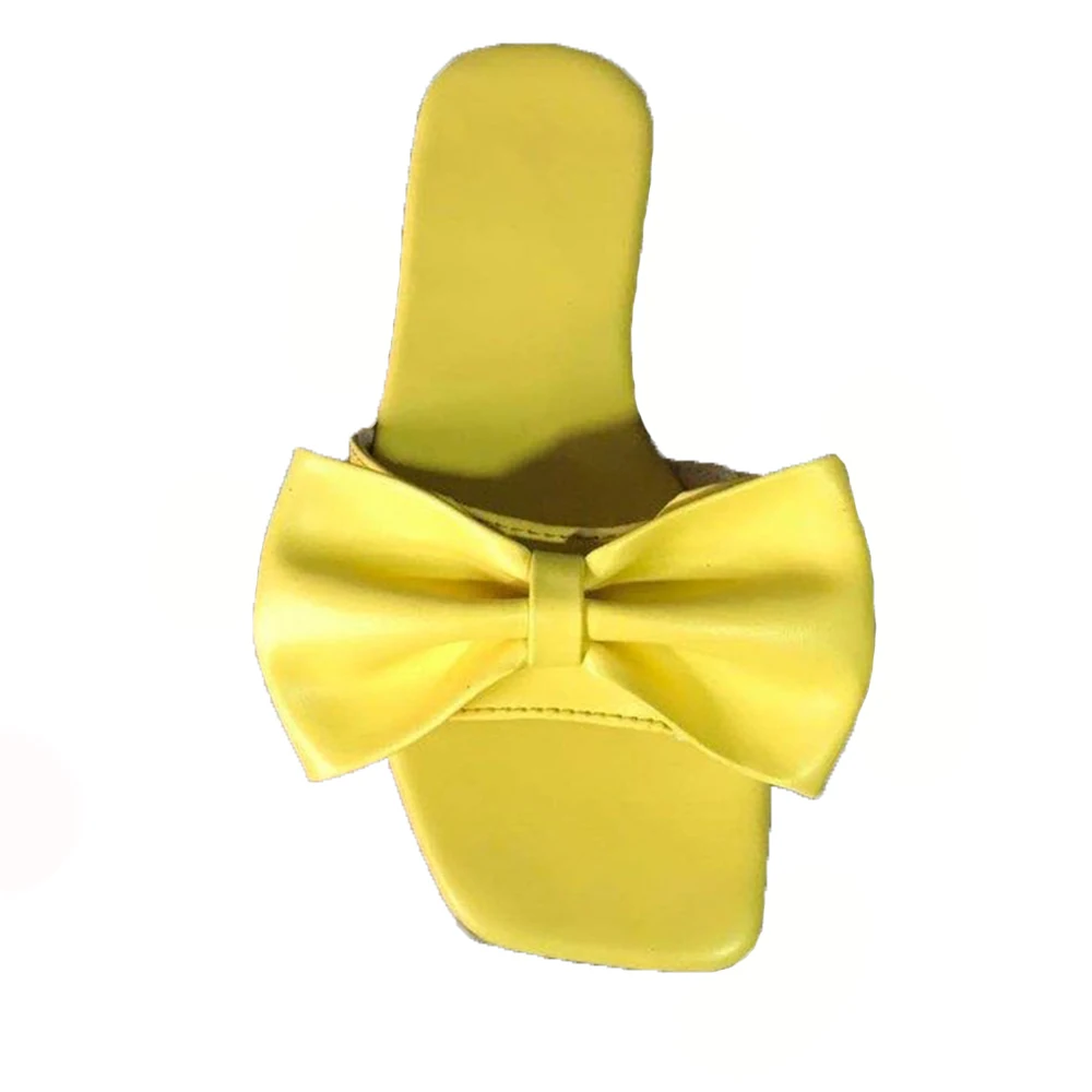 yellow flat sandals with bow