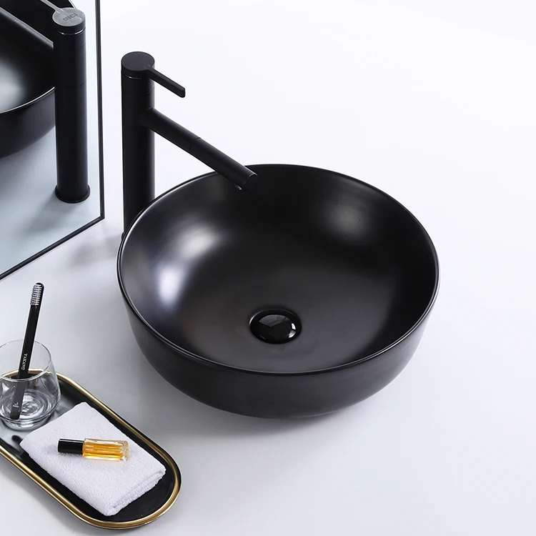 Modern novel design round small plating rose gold black color luxury countertop ceramic sink art washbasin hand wash basin factory