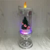 Santa Sleigh and Christmas Tree Scene Water Rotating Glitter Liquid Candle for Christmas Decoration