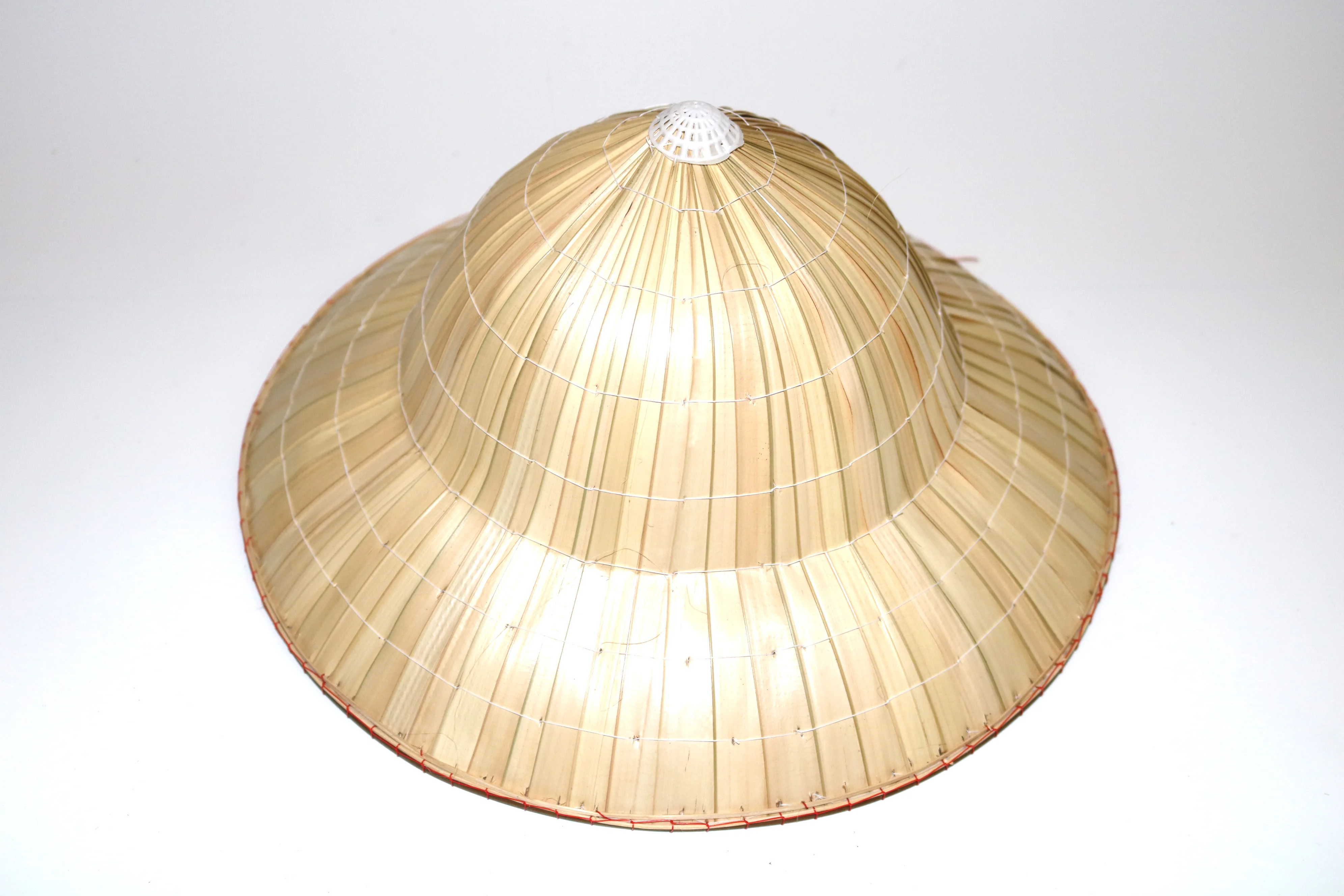 vietnams famer of conical coconut leaf hat