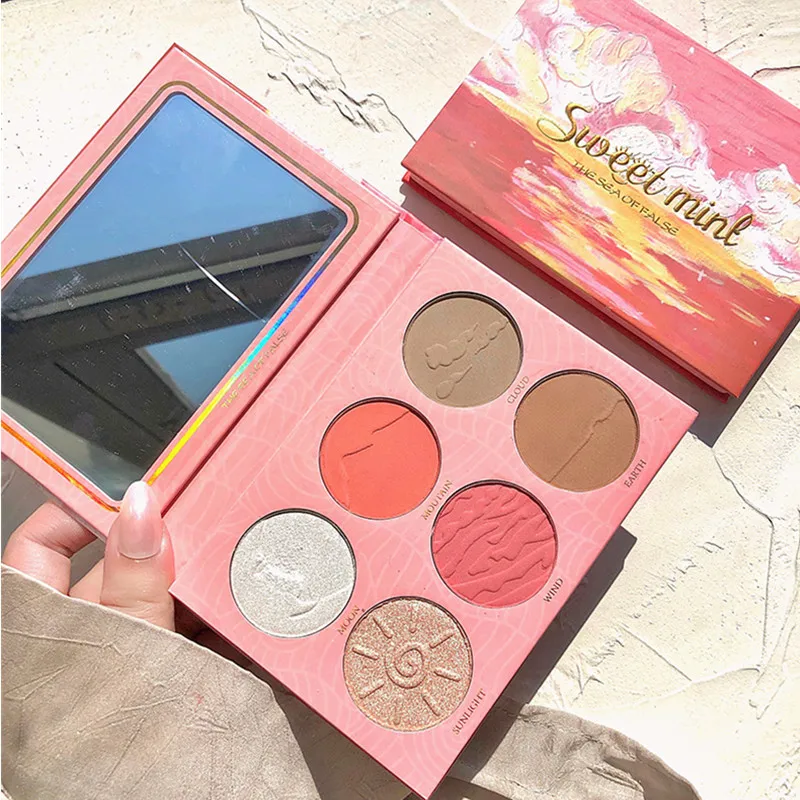 eyeshadow palette with highlighter and blush