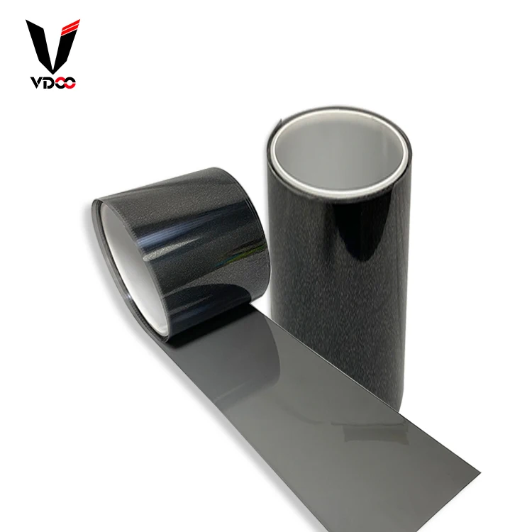 Side-by-side comparison of PET and TPU roll material under angled light showing difference in reflectivity and texture