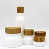 /product-detail/cosmetic-packaging-eco-friendly-5ml-15ml-30ml-50ml-100ml-frosted-bamboo-jar-bamboo-cosmetic-jars-glass-jars-with-wood-lid-62101250607.html