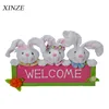 Outdoor Easter yard wooden sign with plush bunny garden hanging stuffed bunny sign board