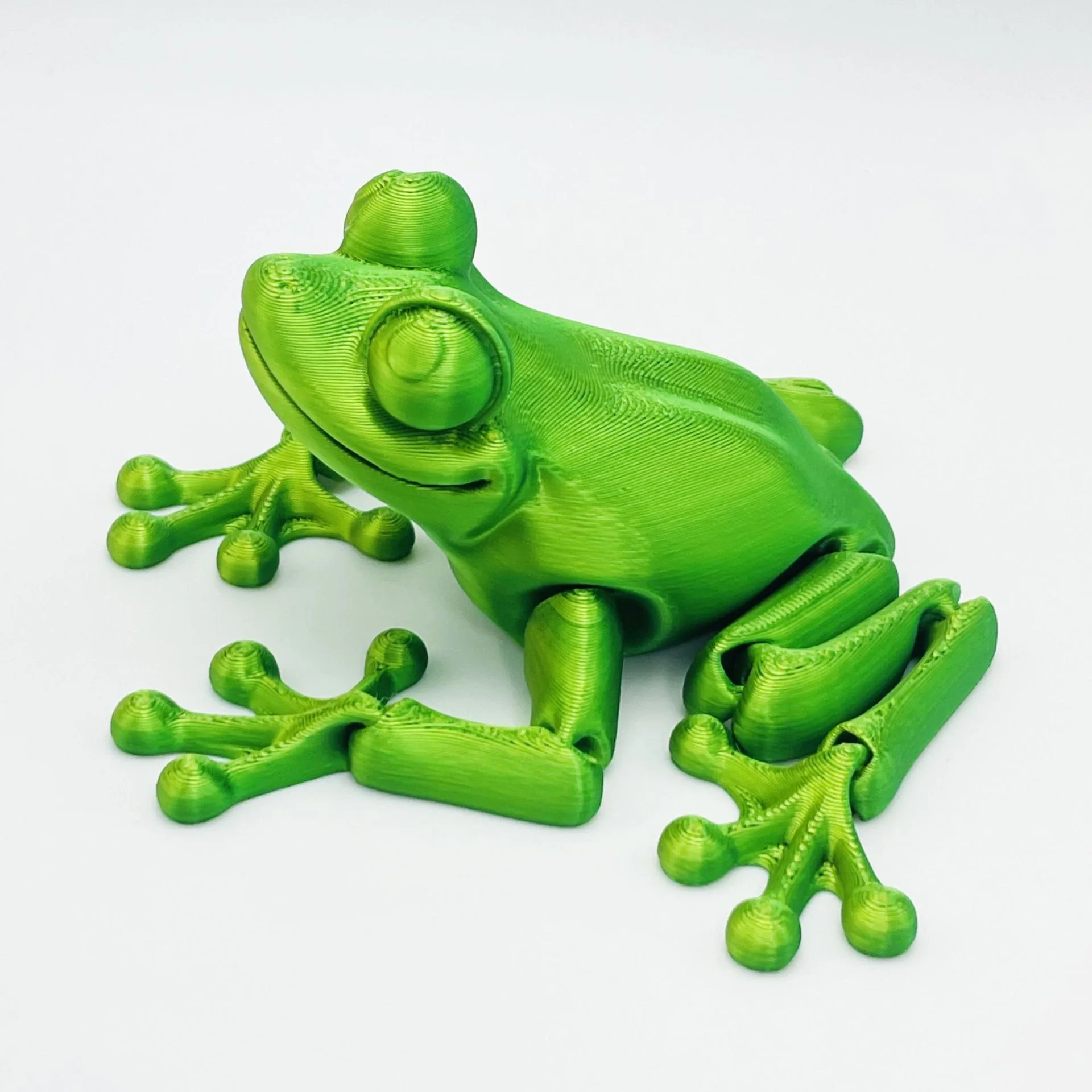 Frog-themed wireless earbud charging case with compact form factor and matte finish