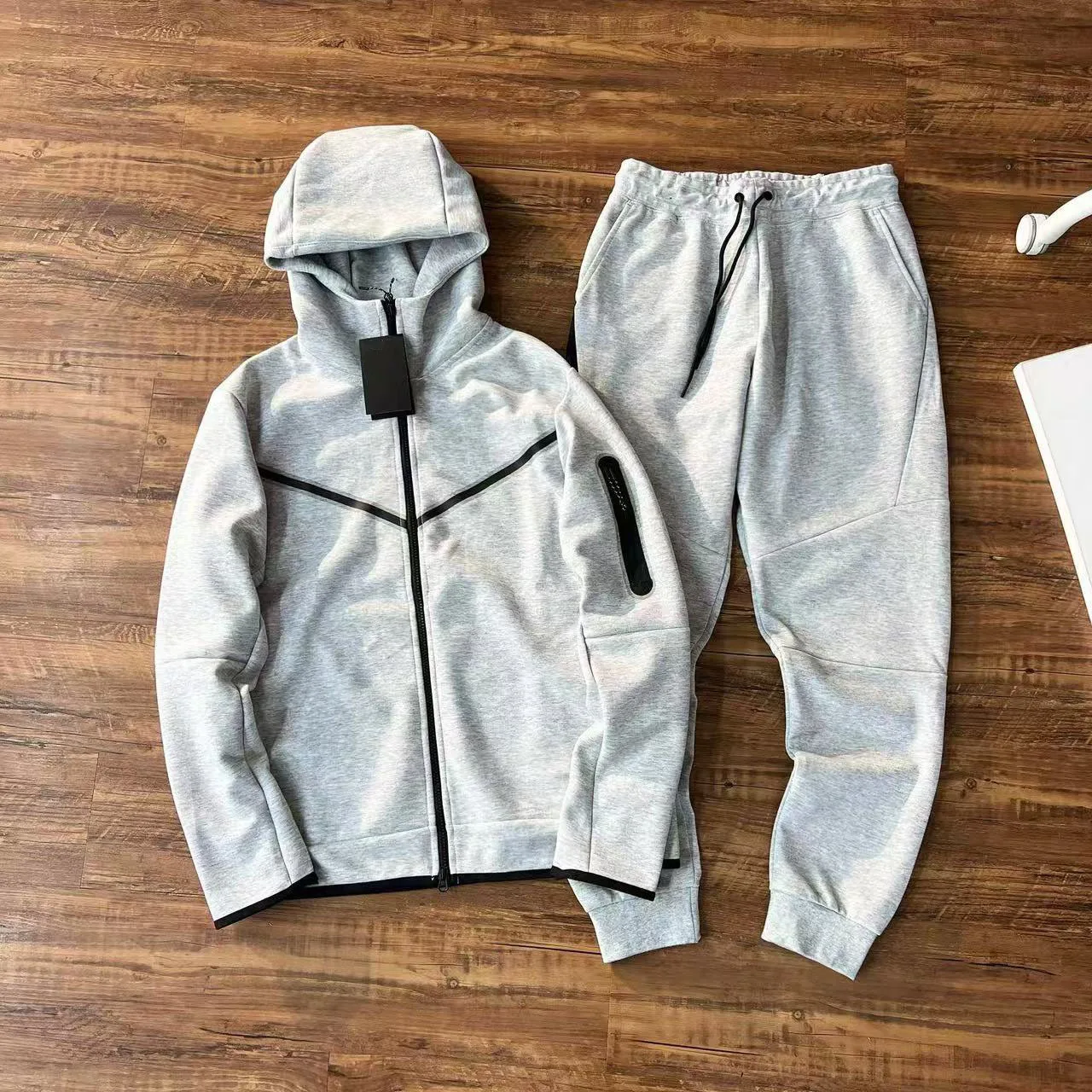 Front view of a black stringless hoodie with clean hood outline and kangaroo pocket