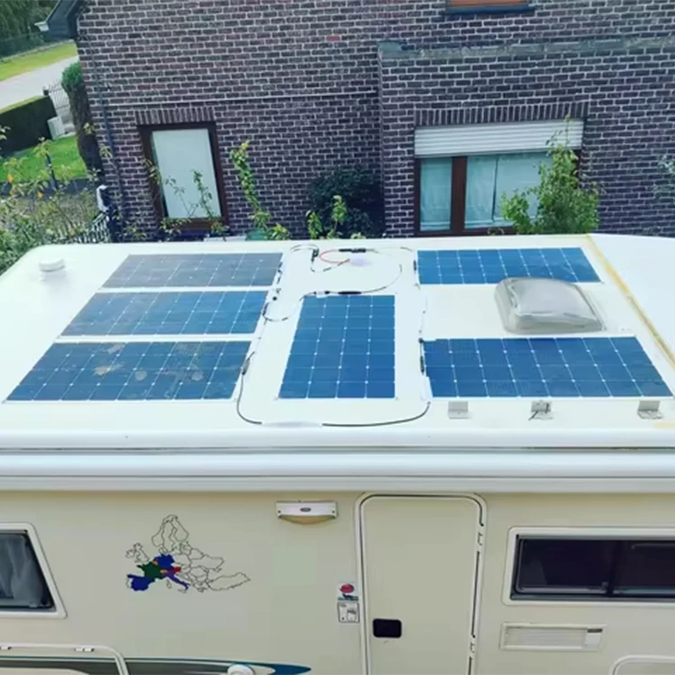 Folded 100W solar panel in carry bag next to hiking boots and water bottle