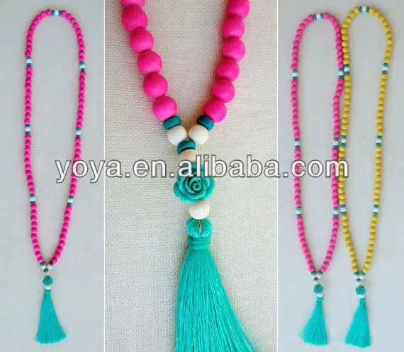 Wooden bead Mala necklace with turquoise stone beads and a pale turquoise tassel.jpg