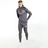 /product-detail/2019-new-jogging-suit-wholesale-side-stripe-hoodie-and-jogger-grey-men-tracksuit-62015746410.html