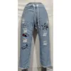 Women sky blue denim joggers jeans with sporty style and elastic waistband at best price