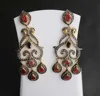 Beautiful Women Wear Diamond Polki Studded 925 Sterling Silver Gold Plated Dangle Earring With Ruby Oval Faceted