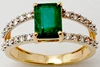 Octagon Cut Center Emerald Ring In Prong Setting With Round Diamond on Rails
