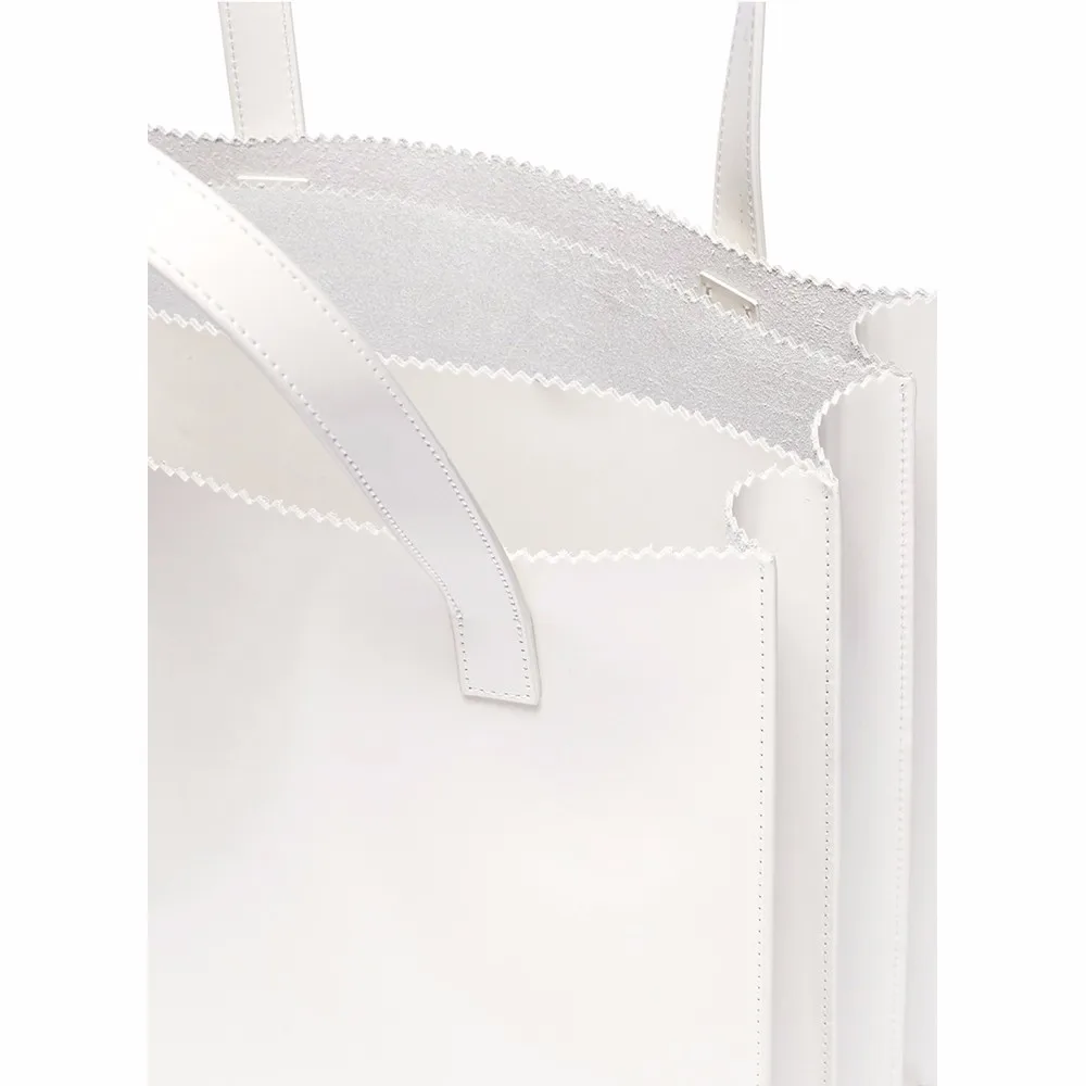 white faux leather bag