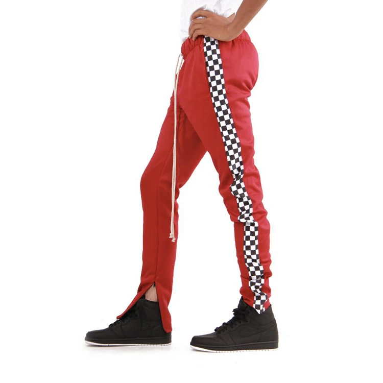 red track pants with white stripe