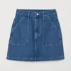 Women's short A-line skirt in washed denim zip fly with button, patch front pockets, and back pockets