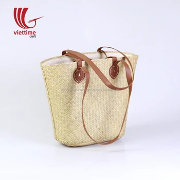 woven bag with leather straps