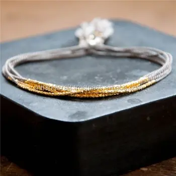 gold string bracelet