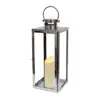 large stainless steel lantern complete with a pillar candle holder