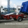 Hook lift swing arm garbage truck