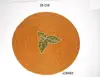 Yellow Glass bead place mats with green leaf patterns other colours also available